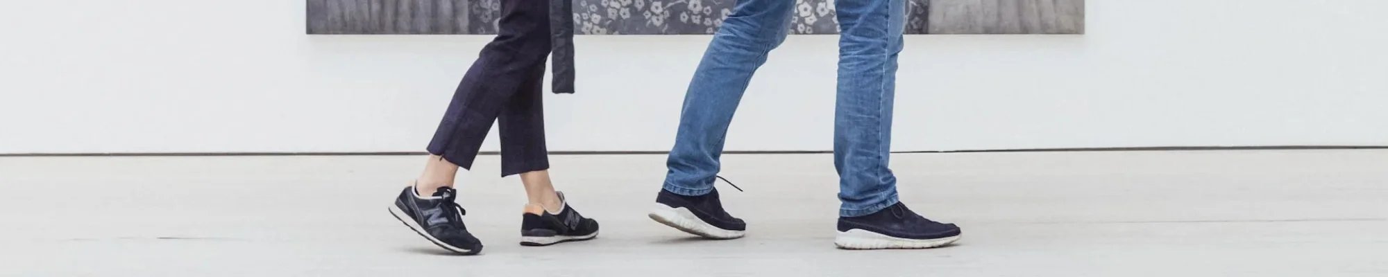 Customers walking on a commercial floor in a bright white building