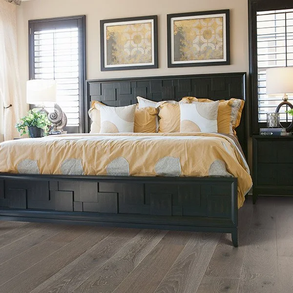 Hardwood flooring in a traditional bedroom