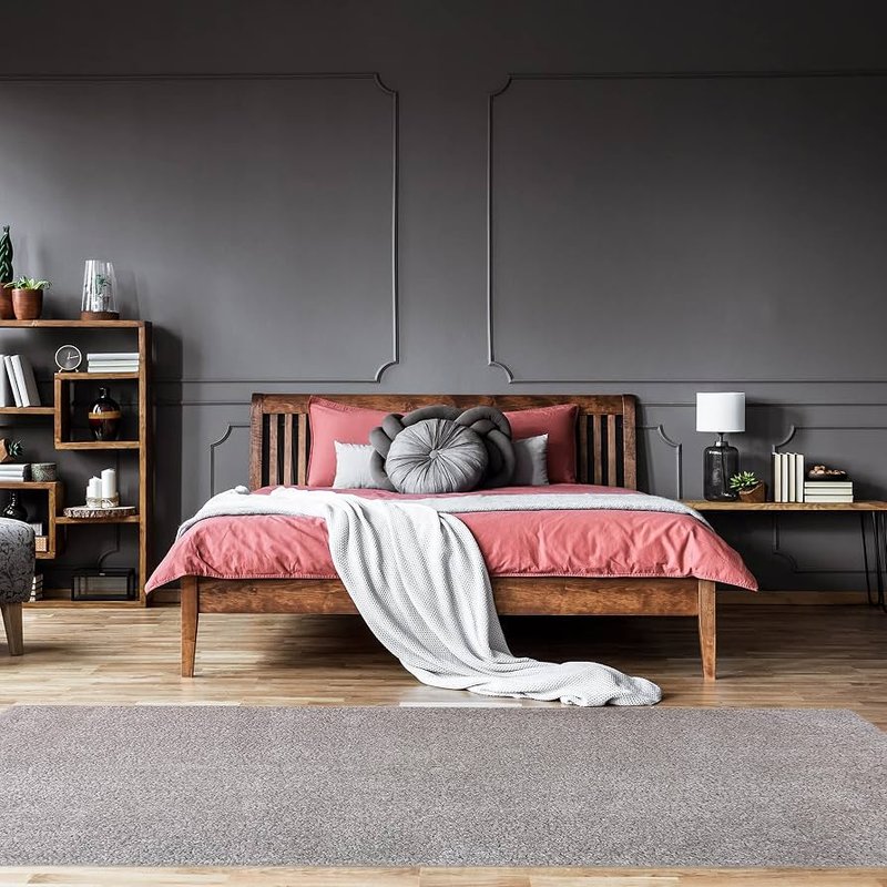 SolidTech flooring and a grey area rug in a bedroom