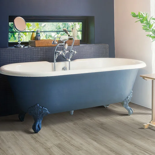 Tub in a modern bathroom with waterproof flooring