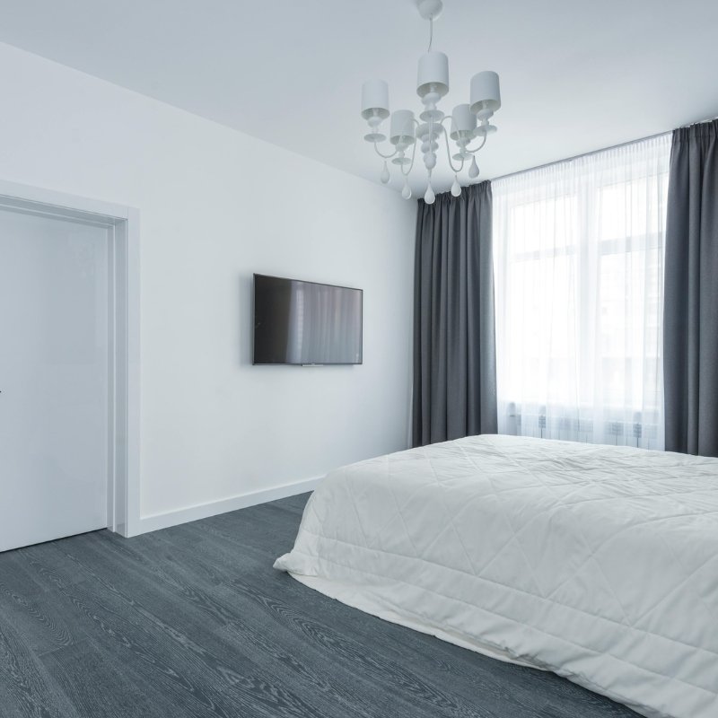 Hotel room with dark grey flooring
